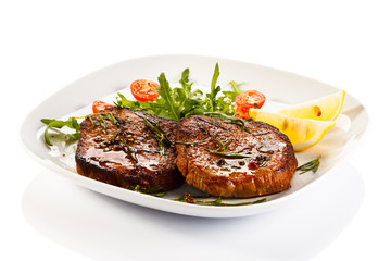 Grilled steaks and vegetables