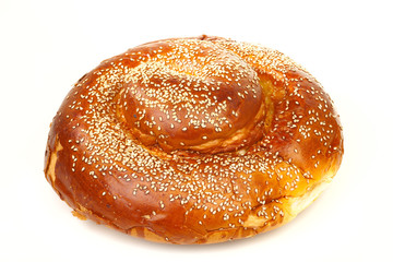 Round sabbath challah with many white seeds