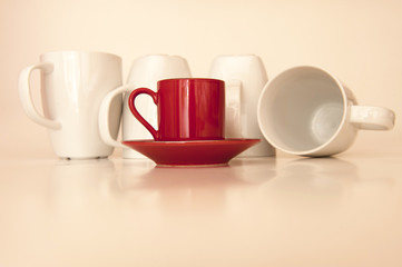 Red Espresso Cup with four white Coffee Cups