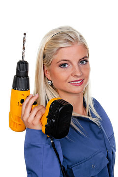 Frau in blauer Arbeits Kleidung mit Bohrmaschine