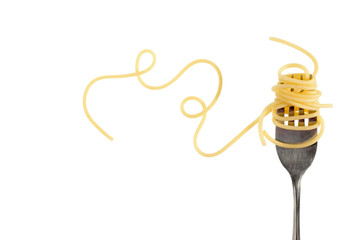 Swirls of cooked spaghetti with fork - obrazy, fototapety, plakaty