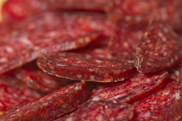 Sliced meat appetizers and cheese in plate