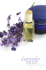 Obraz na płótnie Canvas Lavender with cosmetics (facial cream and lavender oil)