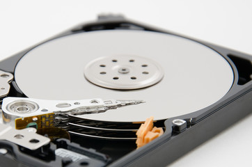 close up of hard disk plate and reader head