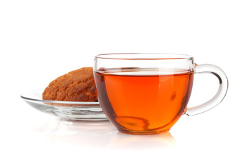 Glass cup of black tea with homemade cookies