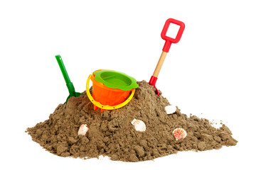 heap sand with plastic toys at the beach