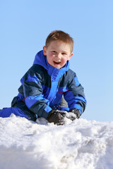 Fototapeta na wymiar boy having fun with snow