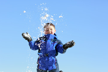 boy having fun with snow