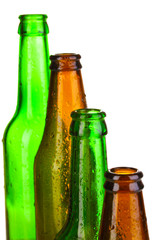 Colorful empty glass bottles isolated on white