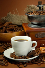 cup of coffee, grinder, turk and coffee beans