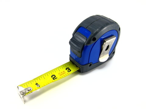 Old used blue tape measure on white background.