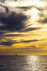 dramatic dark cloudy sunset over the ocean