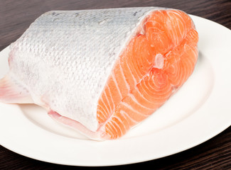 Fresh salmon red fish with lemon and spices