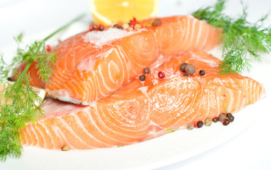 Fresh salmon red fish with lemon and spices