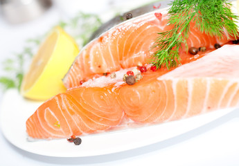 Fresh salmon red fish with lemon and spices