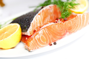 Fresh salmon red fish with lemon and spices