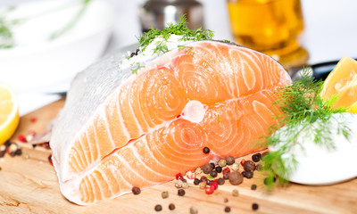 Fresh salmon red fish with lemon and spices