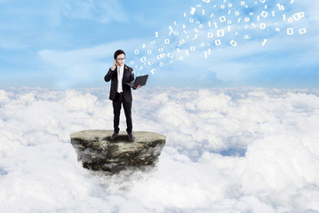 Businessman and social media above clouds