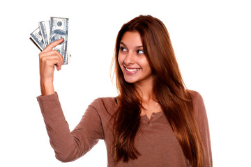 Young woman looking to right hand with cash money
