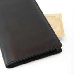 condom in black wallet isolated
