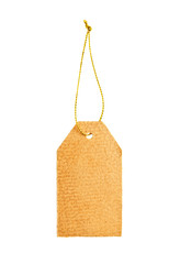 Old paper tag with golden string isolated on white.