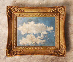 a vintage photo frame with a cloud in it