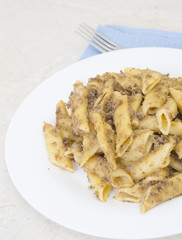 Italian penne pasta with chopped meat