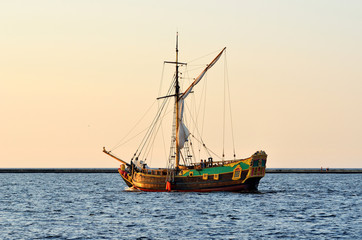 old historical sail ship at the sunset