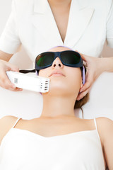 Young woman receiving laser theapy © carol_anne