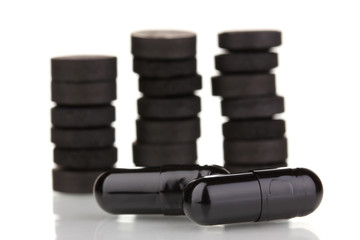 activated carbon in tablets isolated on white