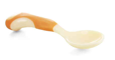 Small beige spoon for babies isolated on white