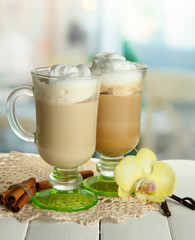 Fragrant coffee latte in glasses cups with spices,