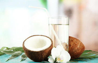Coconut with glass of milk,  on blue wooden table