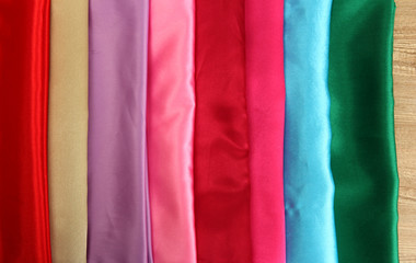 Naklejka premium heap of cloth fabrics, close up