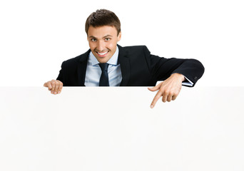 Happy businessman showing signboard, isolated