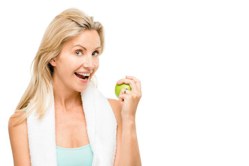 Healthy mature woman exercise green apple isolated on white back