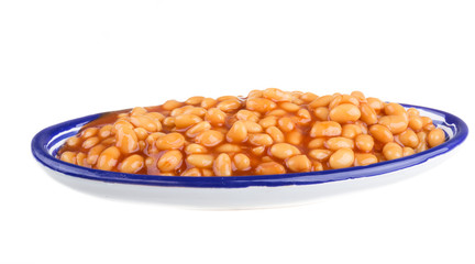 Marinated haricot beans in tomato sauce with shallots on a plate