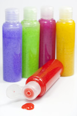 Bath set colorful peeling bottle closeup on white background