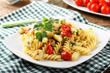 Fusilli with fresh shrimp, peas and tomatoes