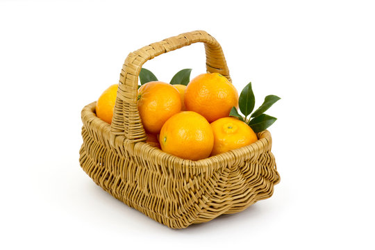 tangerines in a basket on white background