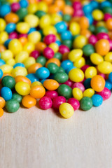 Fototapeta na wymiar colored sugar pearls background