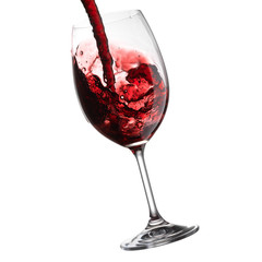 Red Wine Pouring with splashes into wine glass