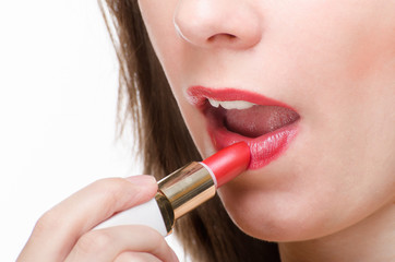 Applying lipstick