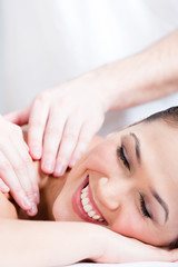 Fototapeta na wymiar Woman receives relaxing body massage at spa