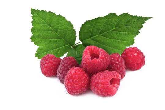 ripe raspberries with leaves isolated on white background
