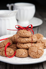 Cup of tea and cookies on wooden background