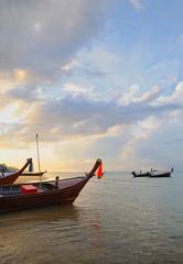 Boats in evening in Kamala bay in Thailand island