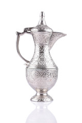 Antique silver pitcher isolated on a white background