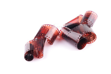 Old camera film strip over a white background