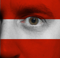 Face with the Austrian flag painted on it